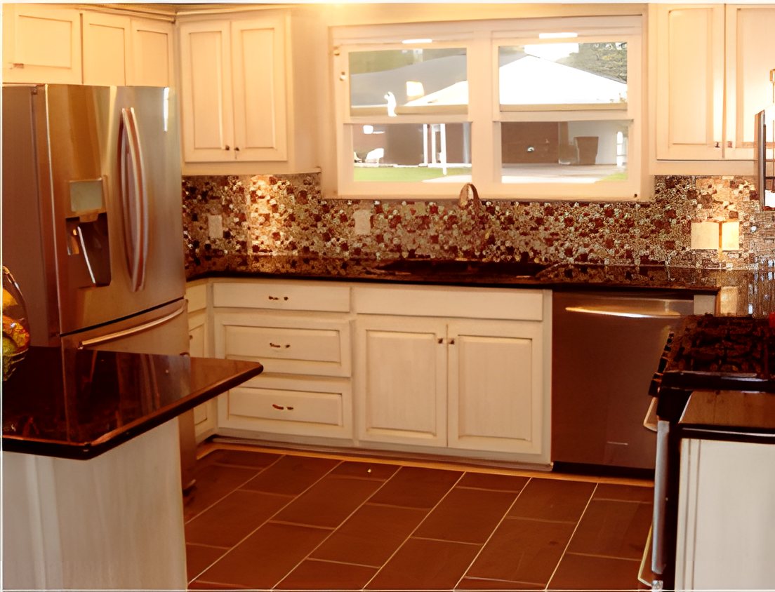 Kitchen with white cabinets, dark granite counters and a mosaic backsplash